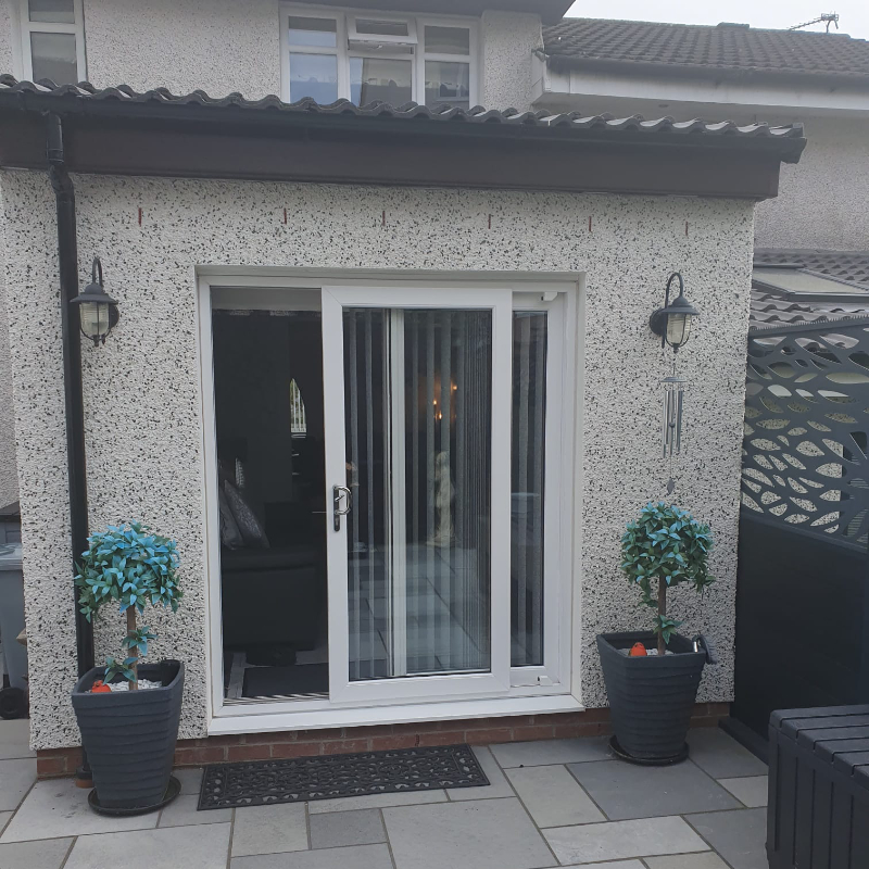 Patio doors in sunroom in back garden
